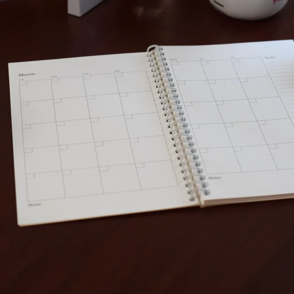 Planner Image 2 Illustrated planner open to monthly planning spread