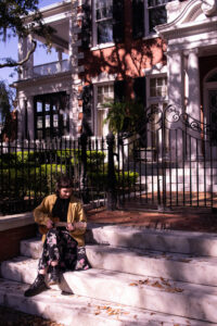 My friend Mak posing in front of Savannah buildings.